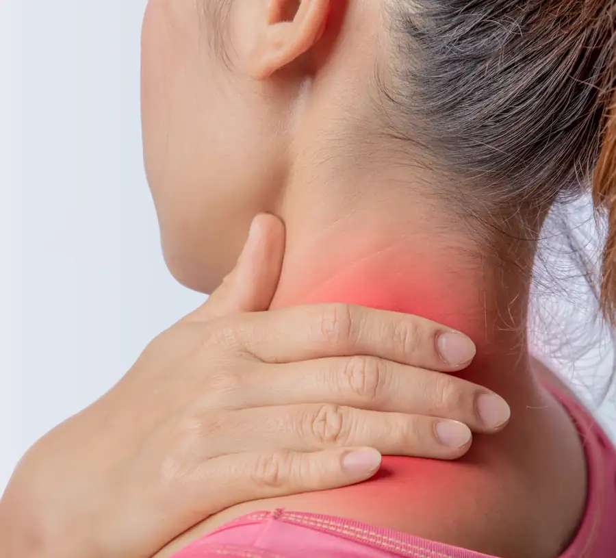 Woman holding the back of her neck where stiffness and pain are highlighted